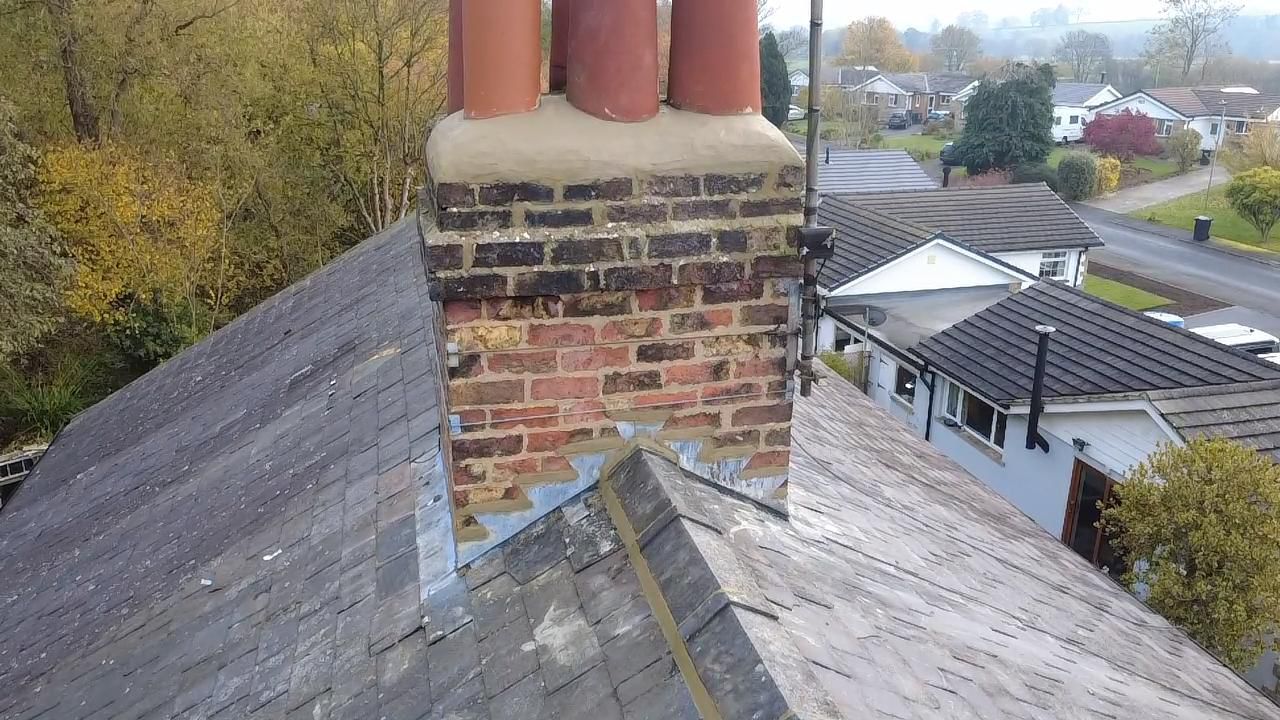 New lead flashing installed around chimney base