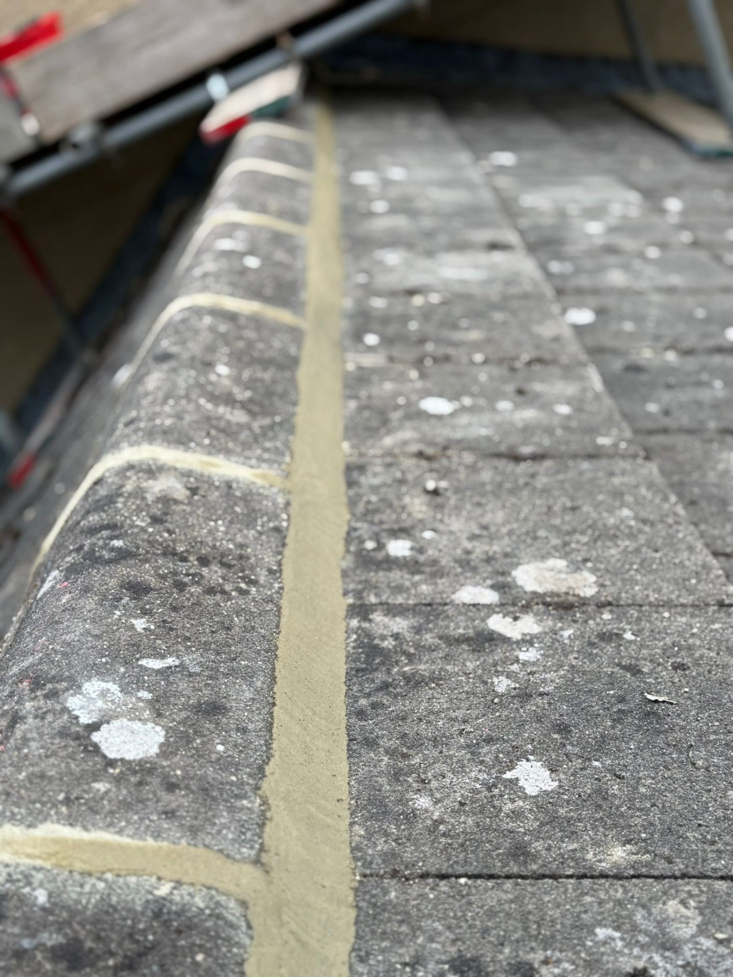 Ridge tile repointing on a 1930s semi-detached in Bradford