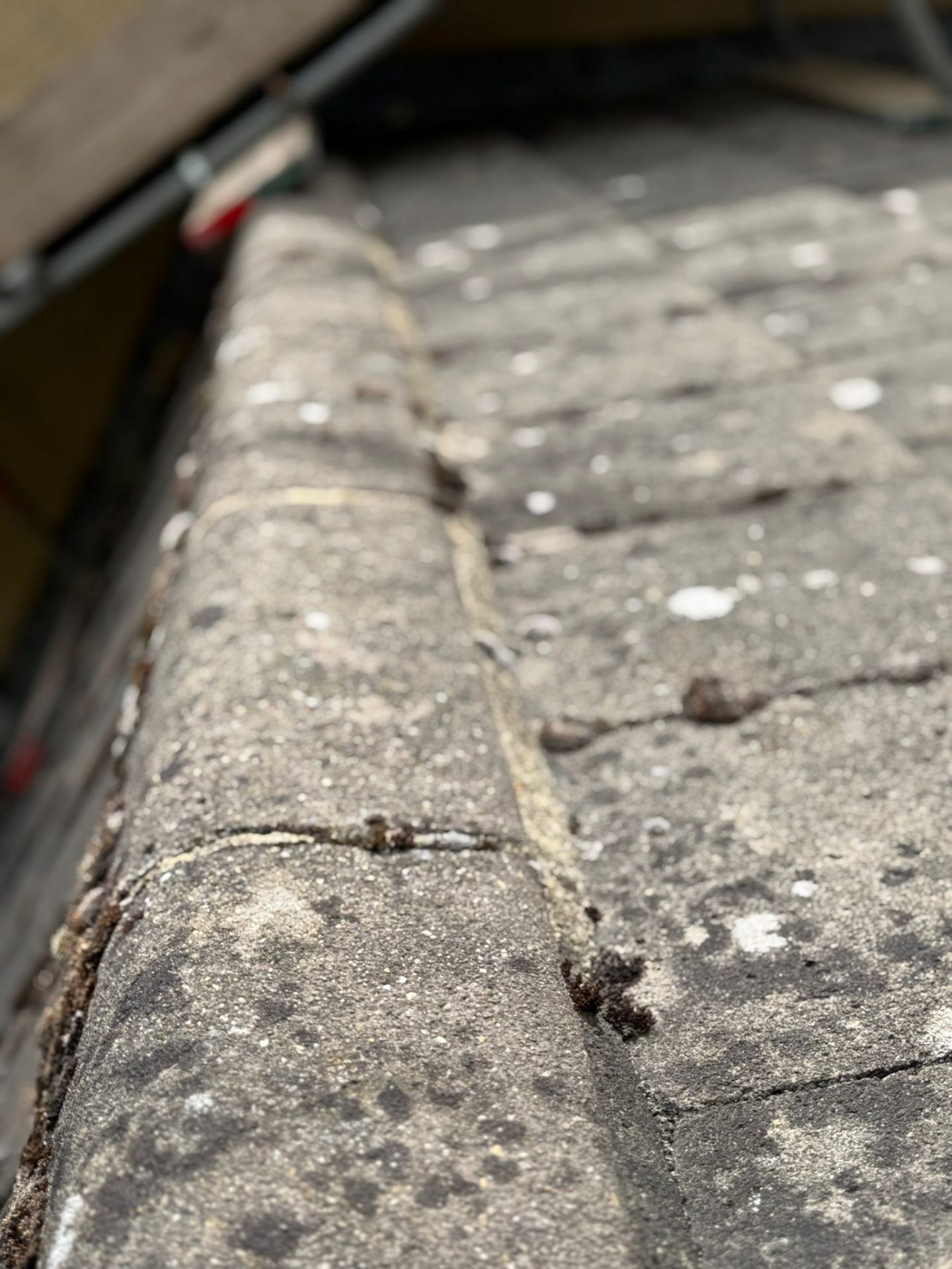 Macro detail of repointed mortar joints on roofline