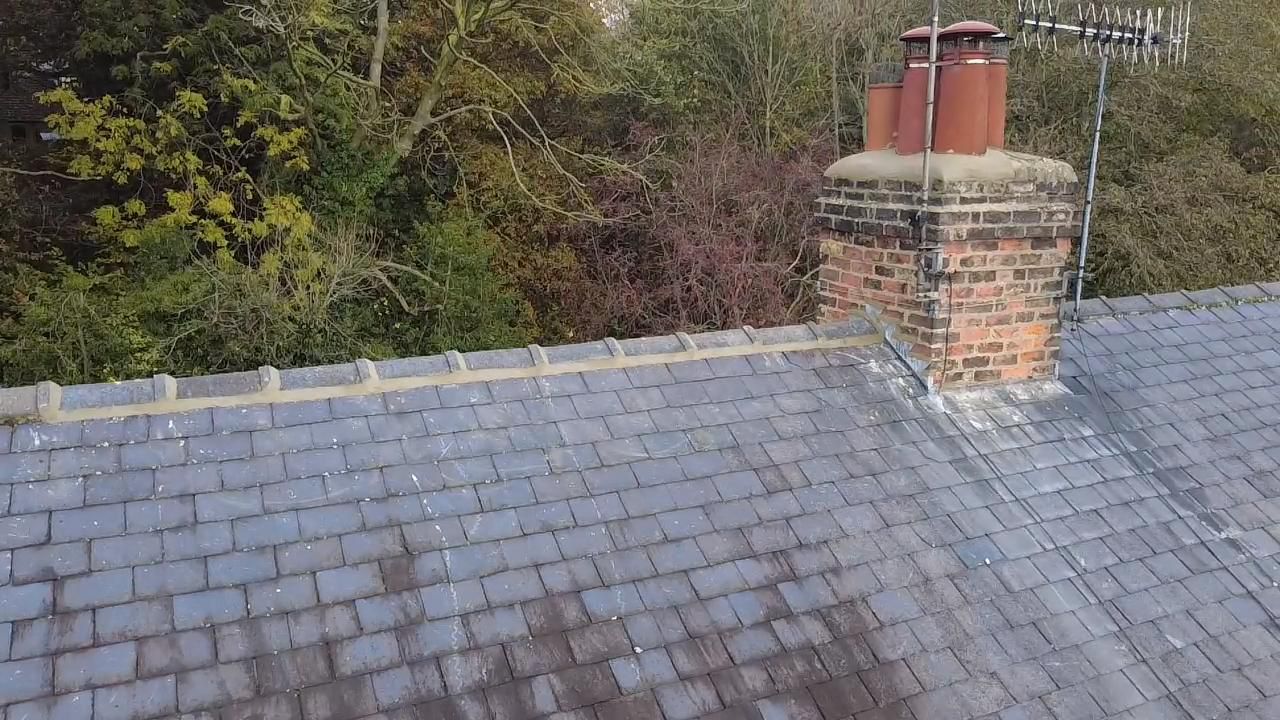 Slate roof with chimney and ridge tile detail