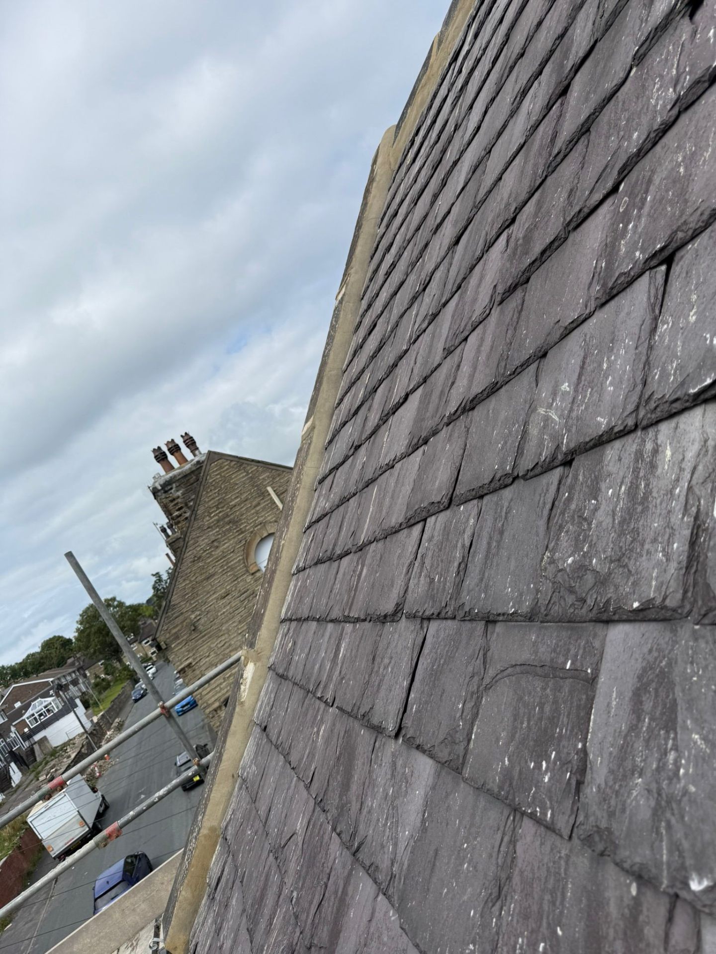 Lead step flashing at wall abutment angle